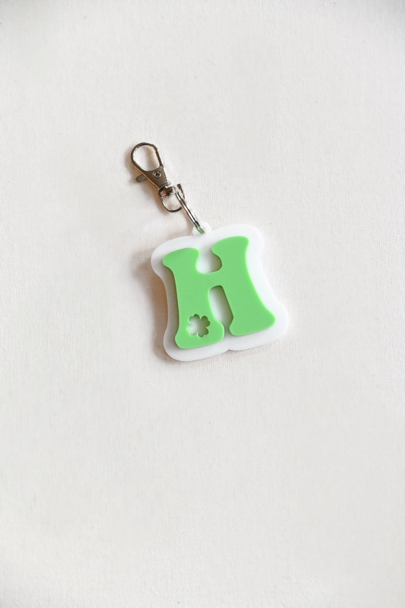  Shamrock Keychain &amp; Basket Tag! Each piece is crafted from high-quality green and white acrylic, featuring the first initial of your name with a delicate shamrock cutout for a unique and festive touch.