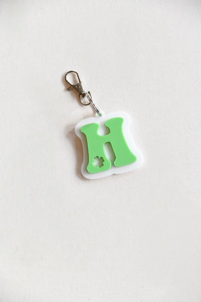  Shamrock Keychain &amp; Basket Tag! Each piece is crafted from high-quality green and white acrylic, featuring the first initial of your name with a delicate shamrock cutout for a unique and festive touch.